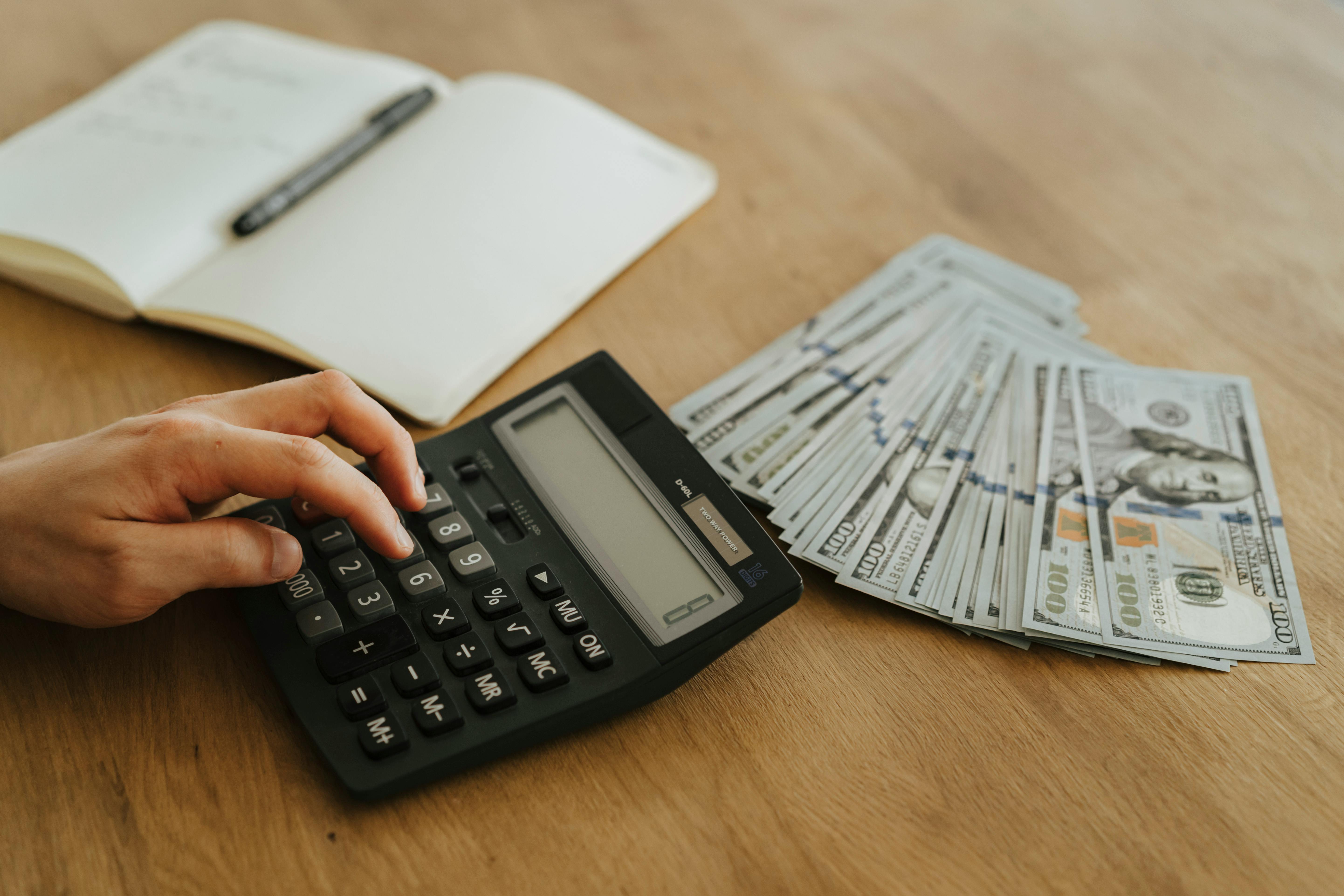 Calculator,%20cash,%20and%20notebook Calculator, cash, and notebook